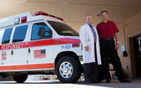 George Gutnik and physician standing by ambulance