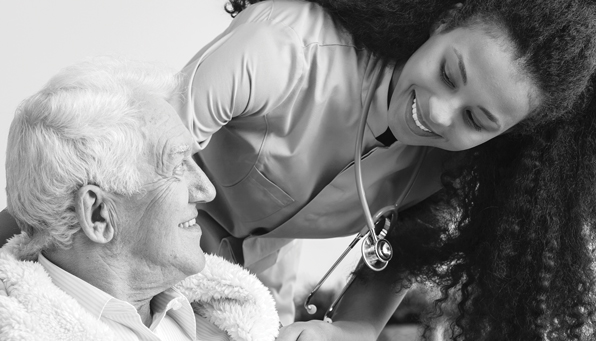 Nurse with elderly male patient in a wheelchair